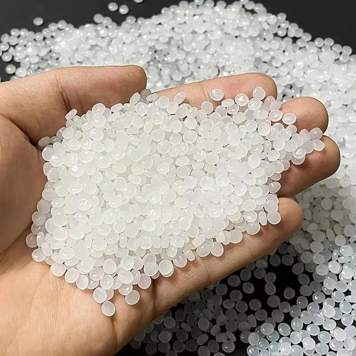 Virgin polymer granules in hand